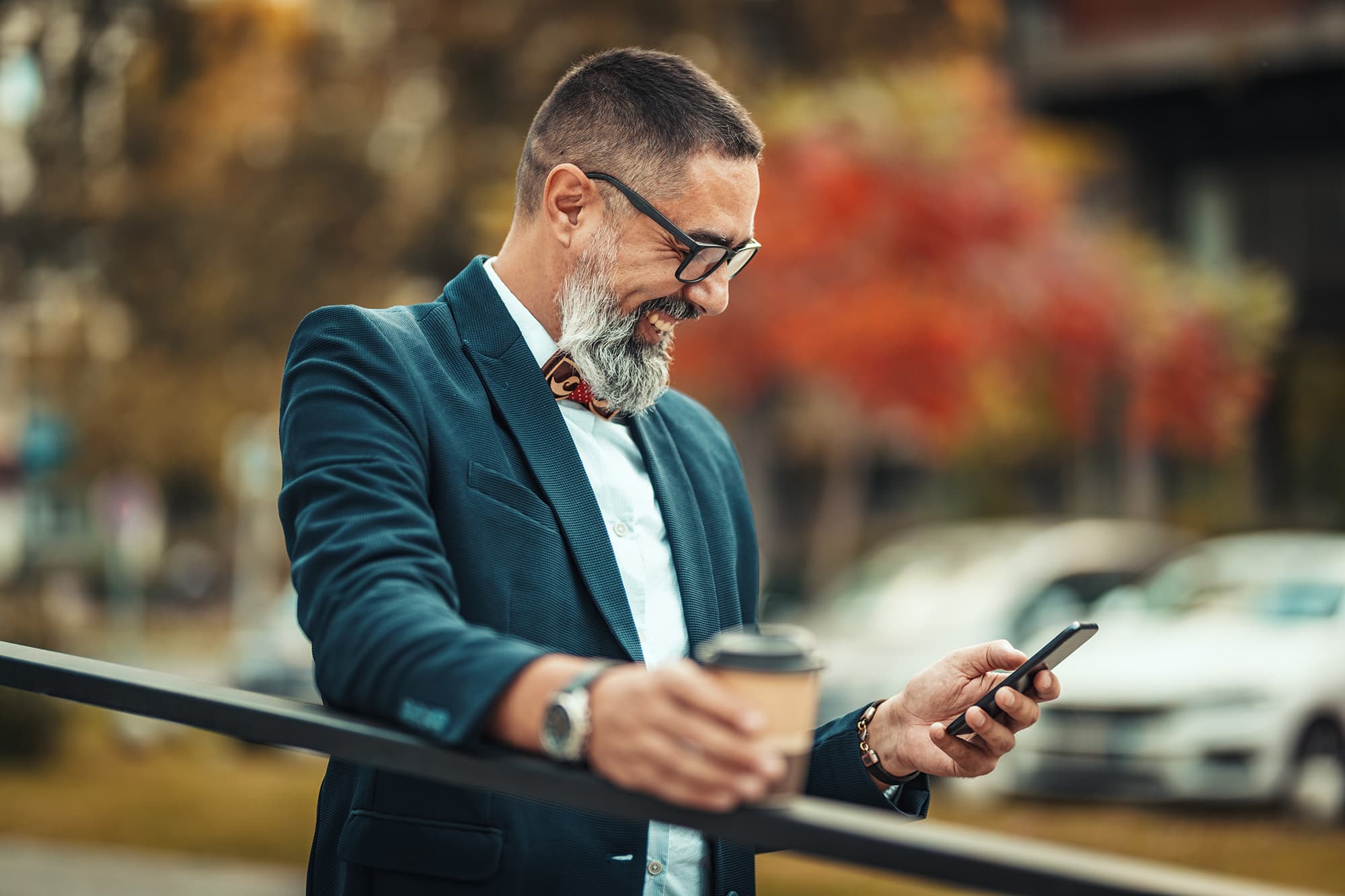 Man on phone checking law firm social media