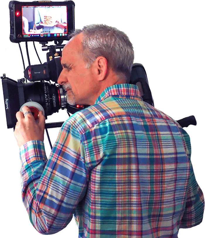 Man with video camera shooting a law firm tv commercial