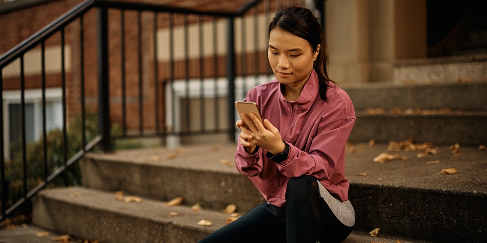 woman on phone performing web search