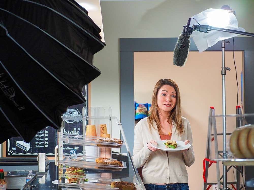 Actress in Law Firm Video Shoot with small sandwich