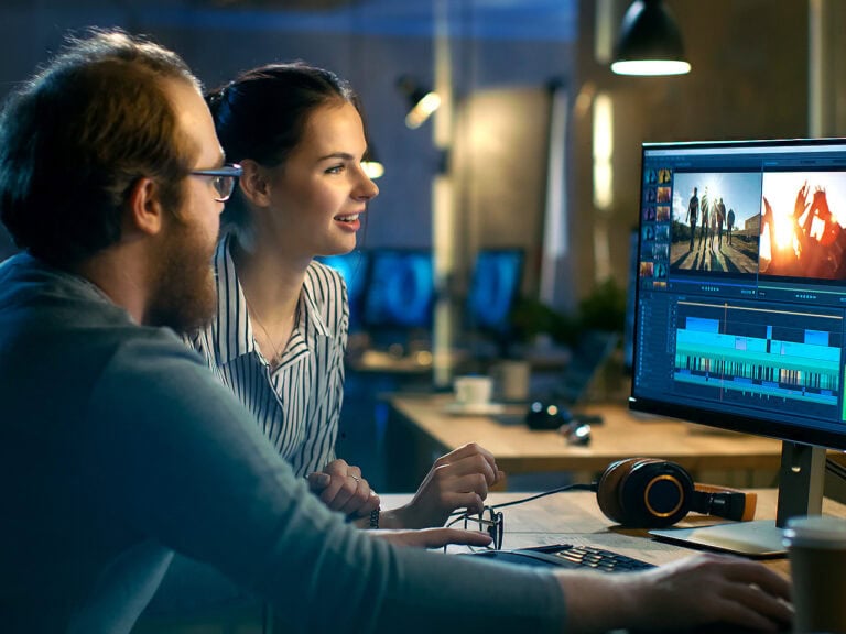 Producers doing video editing on content piece