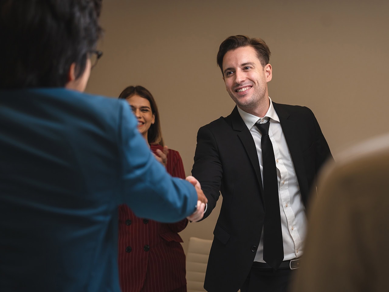 Attorney shaking hands with client